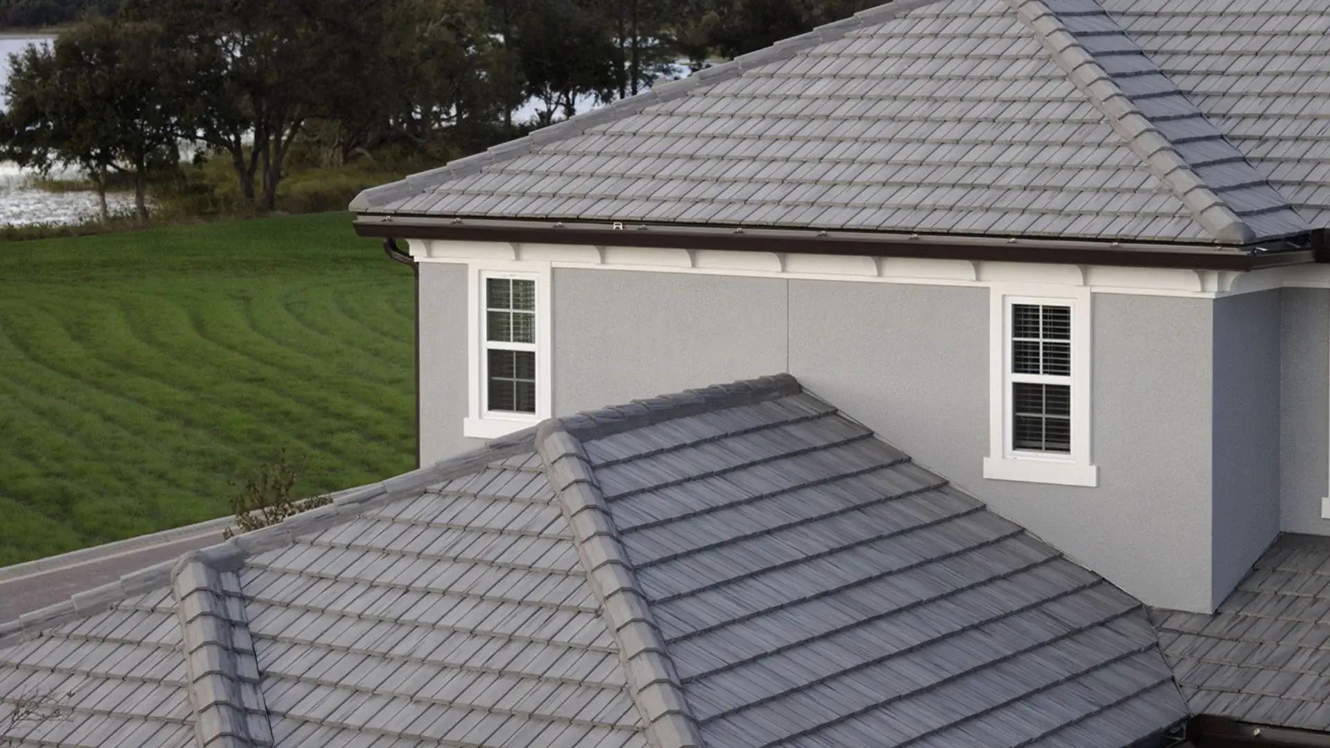 Professional clay flat tile work completed by licensed roofing contractors